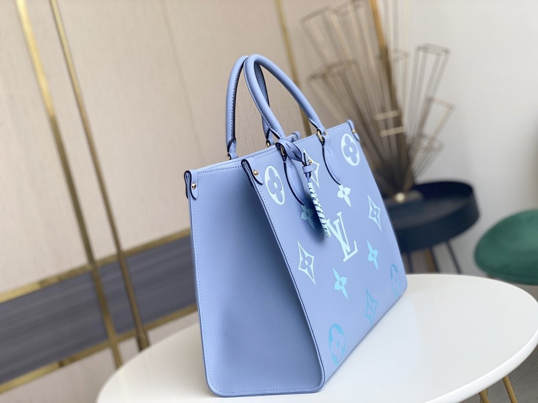 ONTHEGO MM 35CM CUIR DE VACHE GRAINÉ BLEU ÉTÉ 