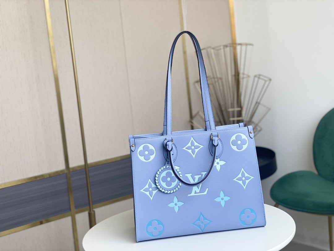 ONTHEGO MM 35CM CUIR DE VACHE GRAINÉ BLEU ÉTÉ 