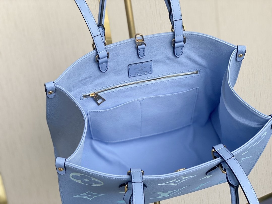 ONTHEGO MM 35CM CUIR DE VACHE GRAINÉ BLEU ÉTÉ 