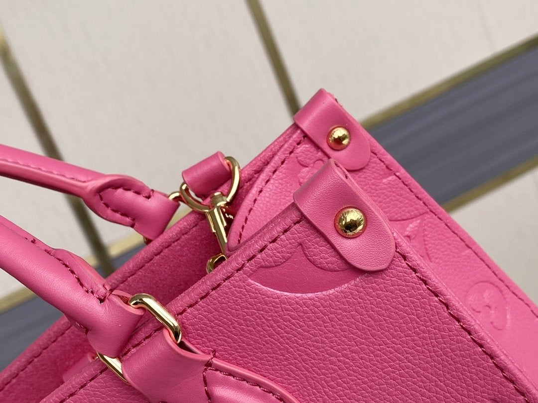 ONTHEGO MM 35CM CUIR DE VACHE GRAINÉ ROSE GAUFRÉ