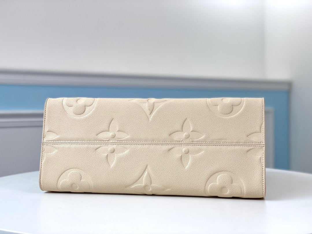 TOILE GÉANTE EMPREINTE MONOGRAMME CRÈME ONTHEGO GM 41