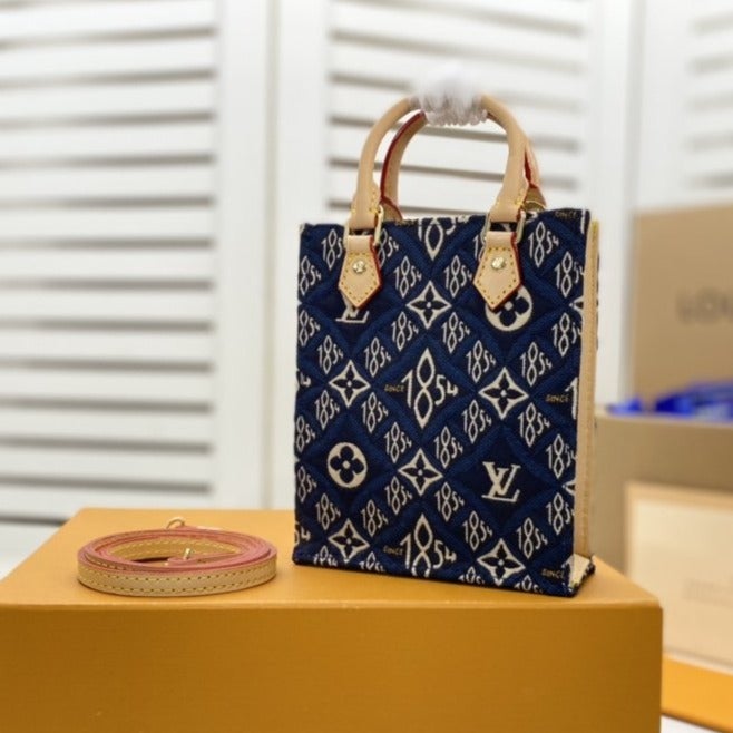 PETIT SAC PLAT BLEU MONOGRAMME DEPUIS 1854 TEXTILE