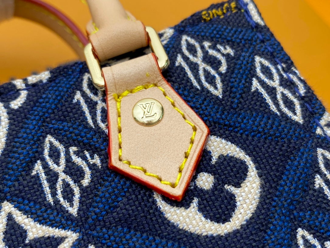 PETIT SAC PLAT BLEU MONOGRAMME DEPUIS 1854 TEXTILE