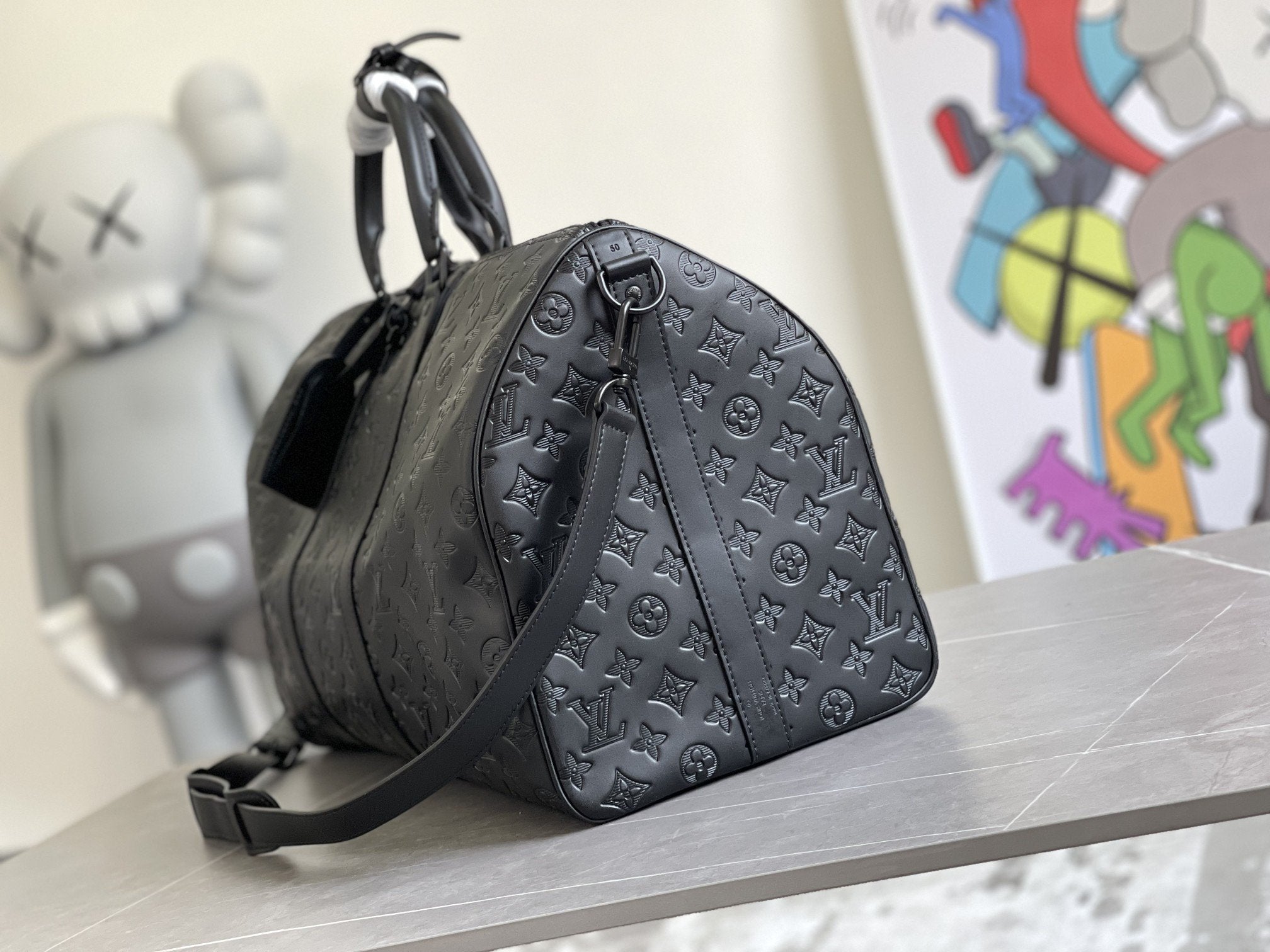 KEEPALL 50 BANDOULIERE CUIR EMPREINTE NOIR