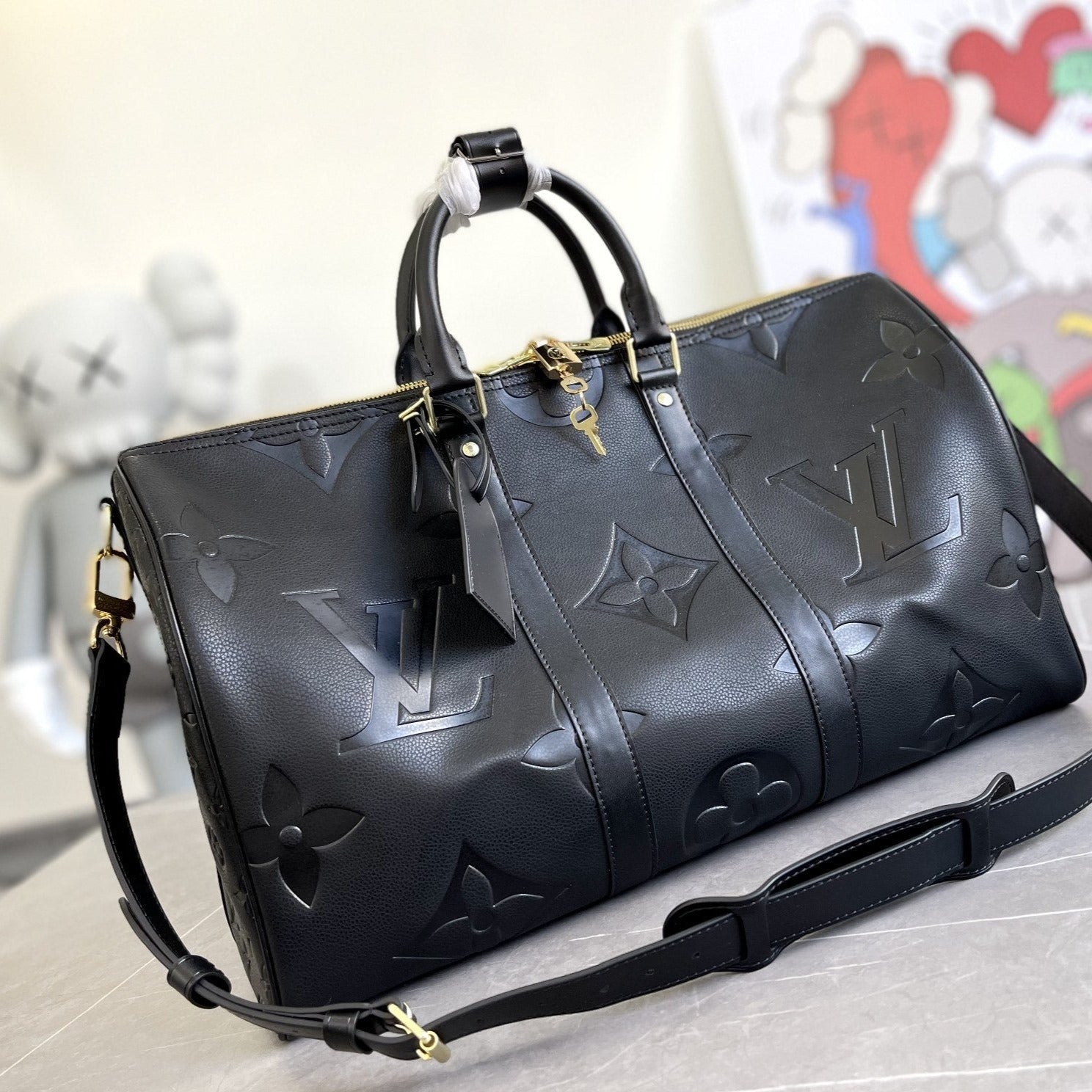 KEEPALL 45 BANDOULIERE MONOGRAMME EMPREINTE GÉANT