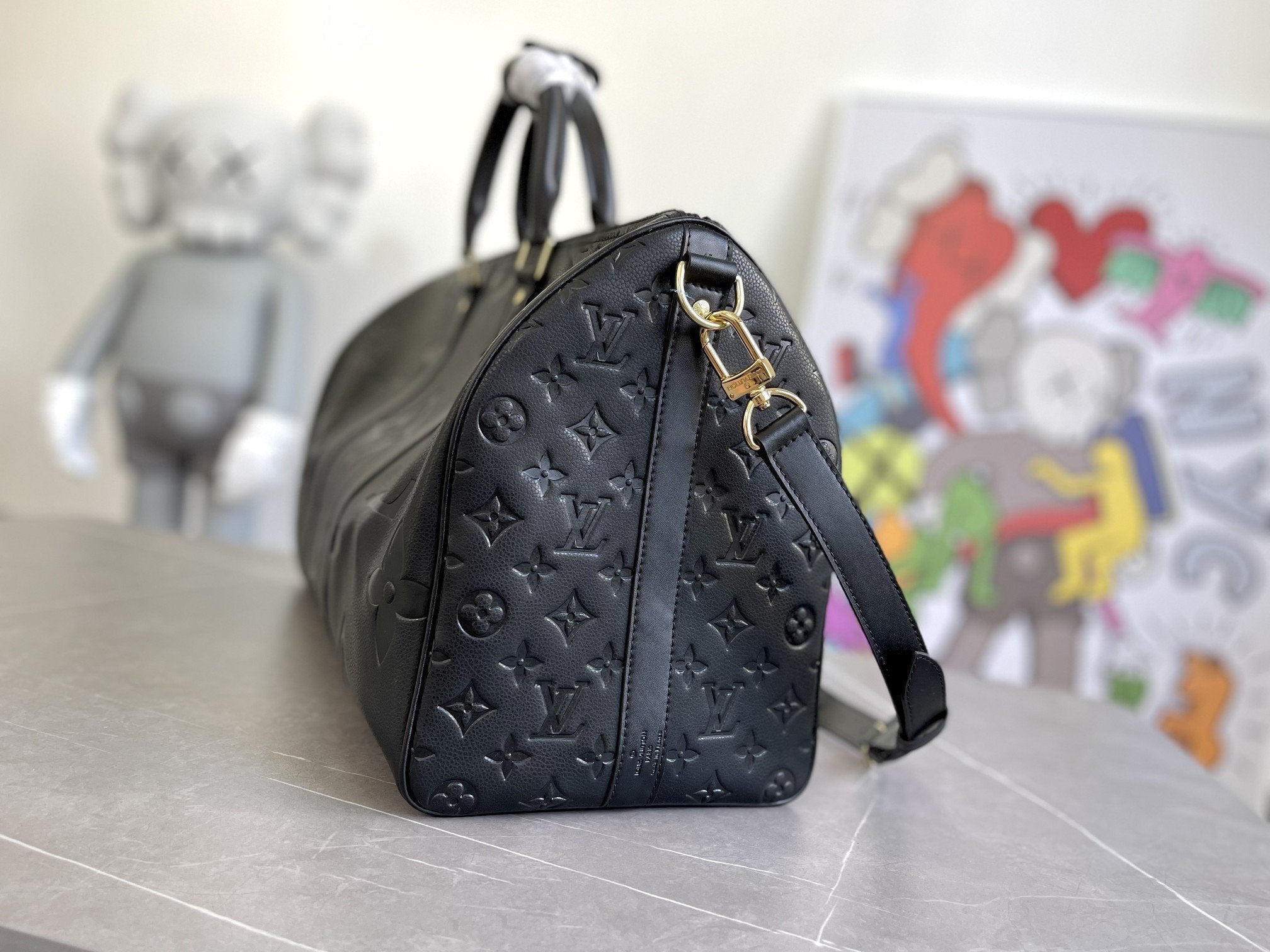 KEEPALL 45 BANDOULIERE MONOGRAMME EMPREINTE GÉANT