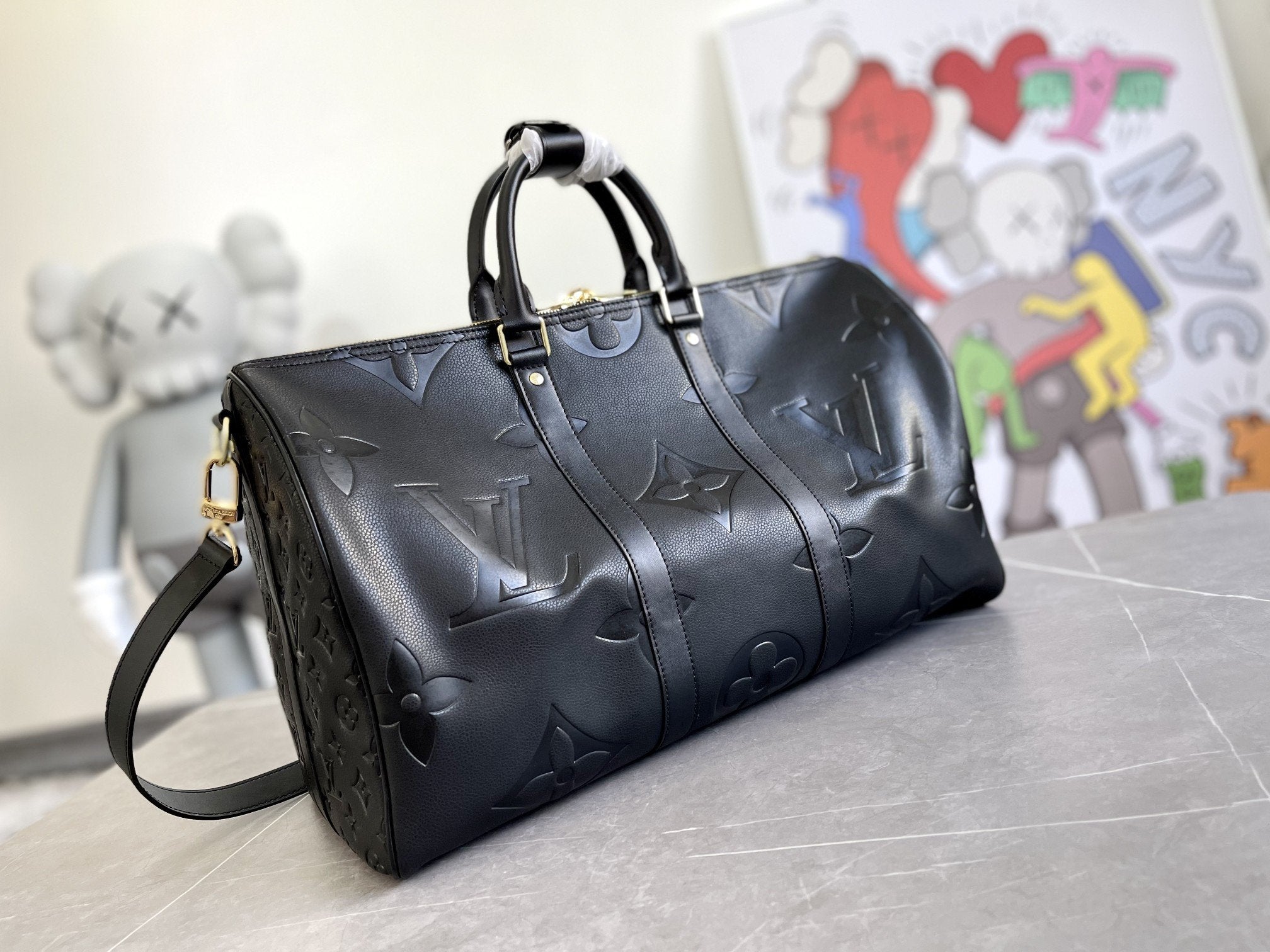 KEEPALL 45 BANDOULIERE MONOGRAMME EMPREINTE GÉANT