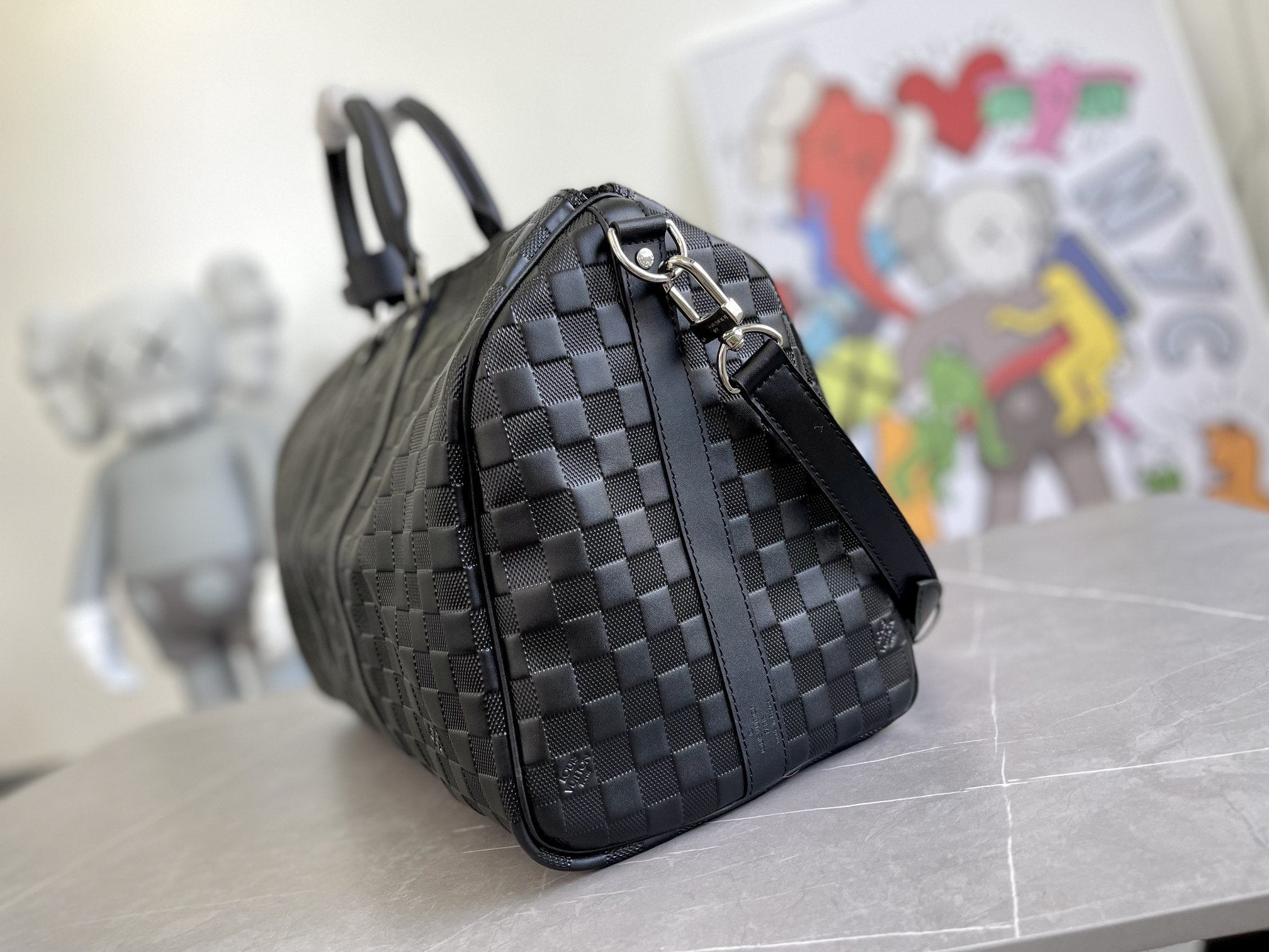 KEEPALL 45 BANDOULIERE NOIR EMPREINTE INFINI 