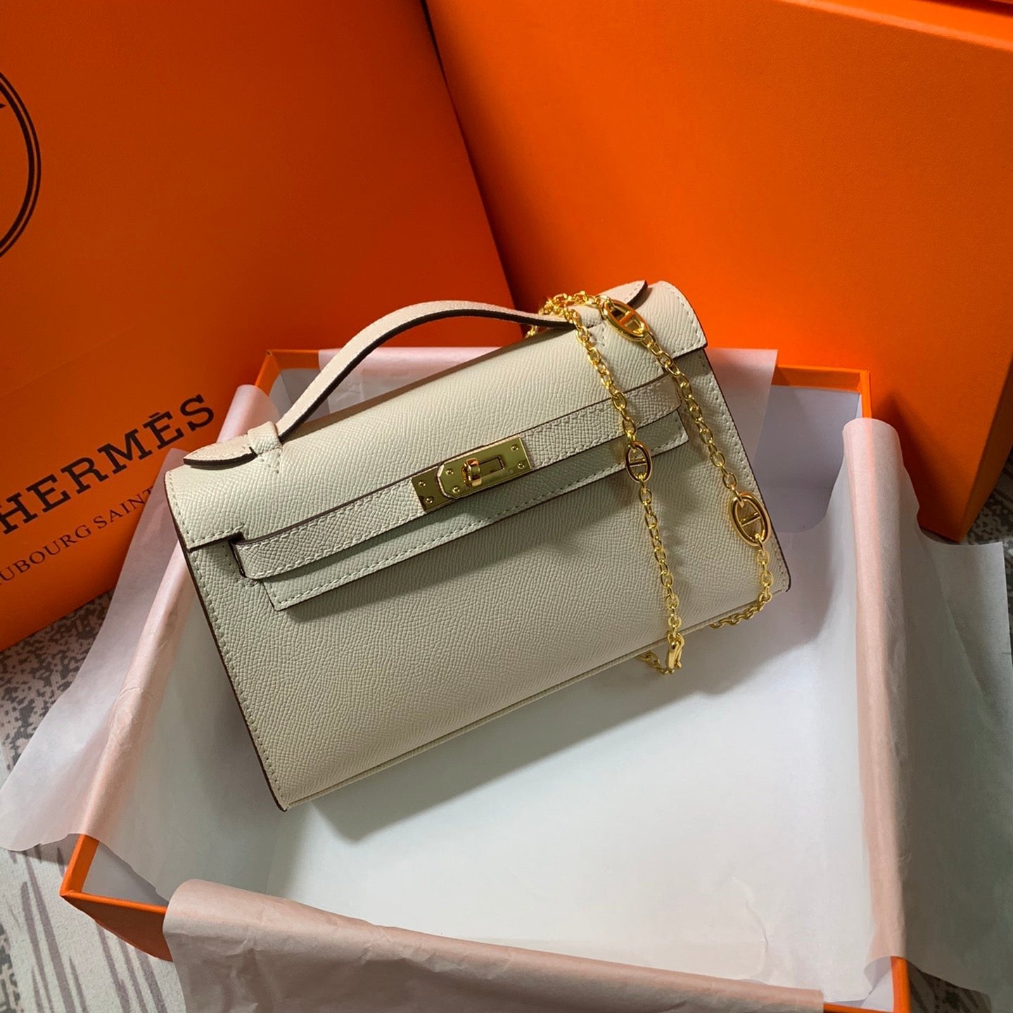 HM KELLY MINI POCHETTE 22 CRÈME EPSOM