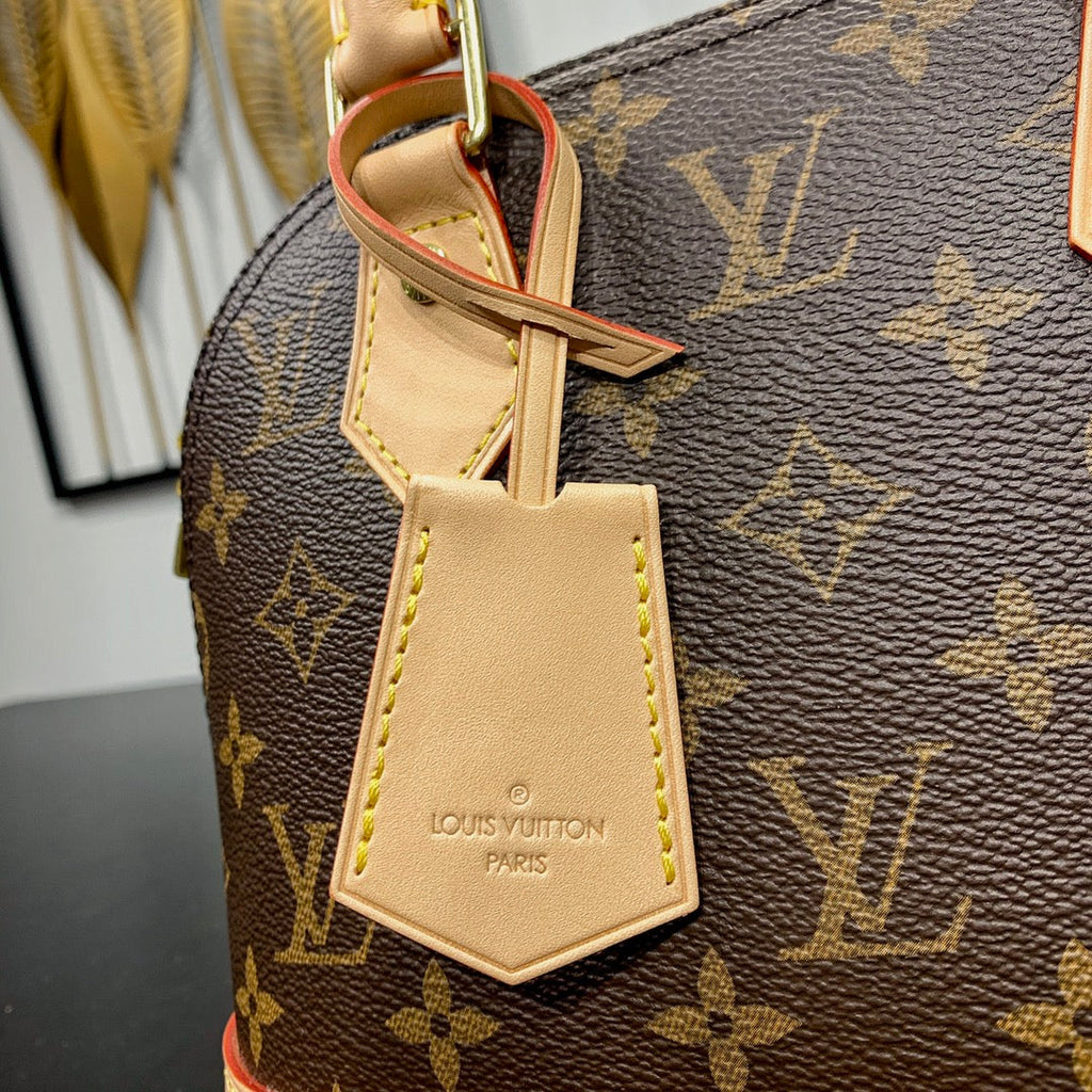 ALMA BB 23 EN TOILE MONOGRAMME MARRON ET GARNITURE EN CUIR DE VEAU BEIGE BOUCLE DORÉE