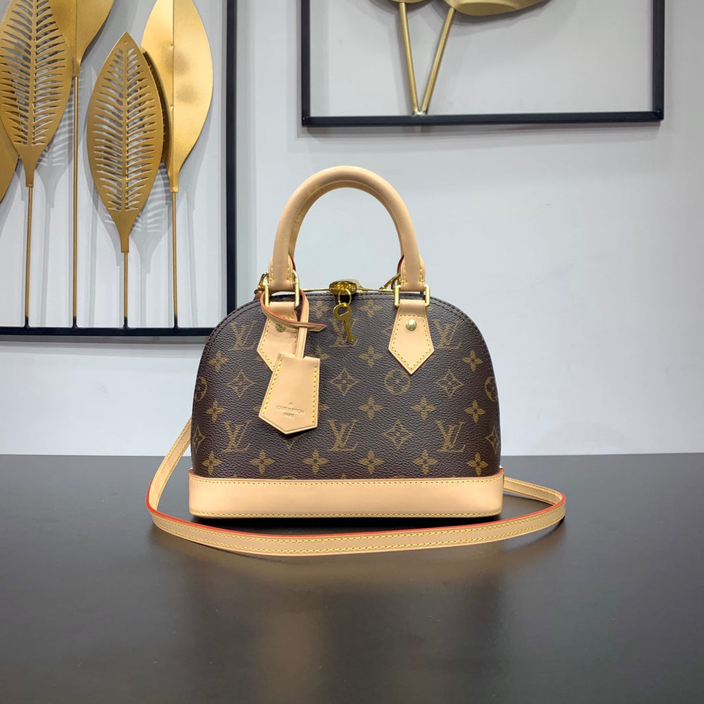 ALMA BB 23 EN TOILE MONOGRAMME MARRON ET GARNITURE EN CUIR DE VEAU BEIGE BOUCLE DORÉE