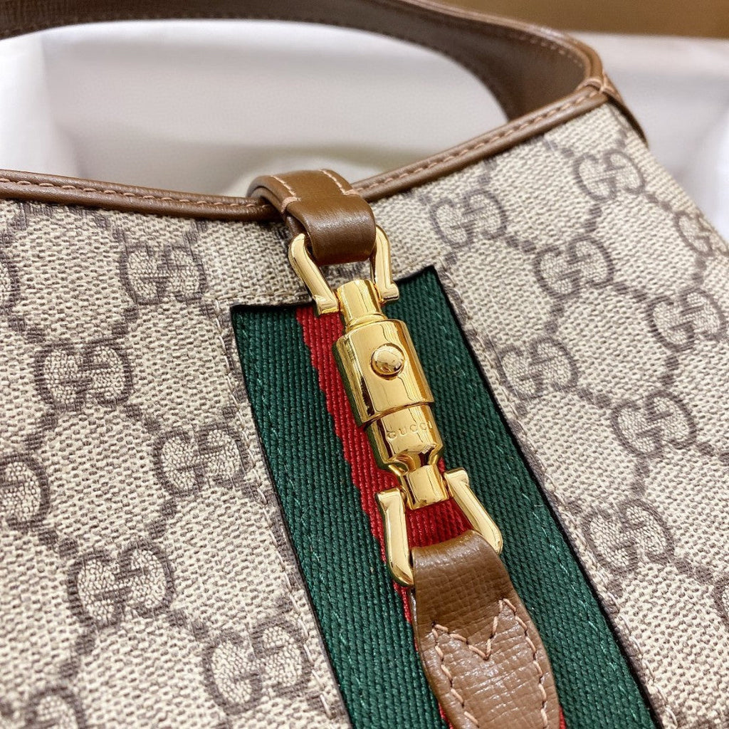 JACKIE 1961 PETIT SAC BANDOULIÈRE 28 EN TOILE BEIGE ET CUIR DE VEAU MARRON