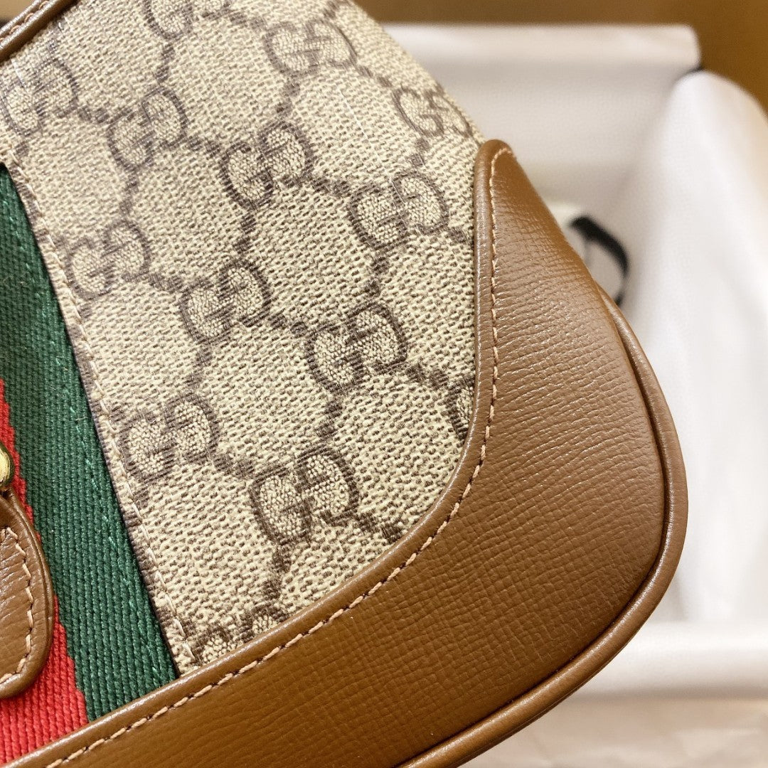 JACKIE 1961 PETIT SAC BANDOULIÈRE 28 EN TOILE BEIGE ET CUIR DE VEAU MARRON