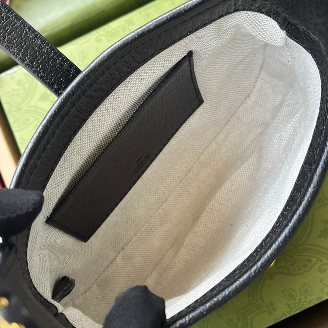 Petit sac à main Jackie 1961 19 pouces en denim noir et jaune, garniture en cuir de veau noir, matériel doré.