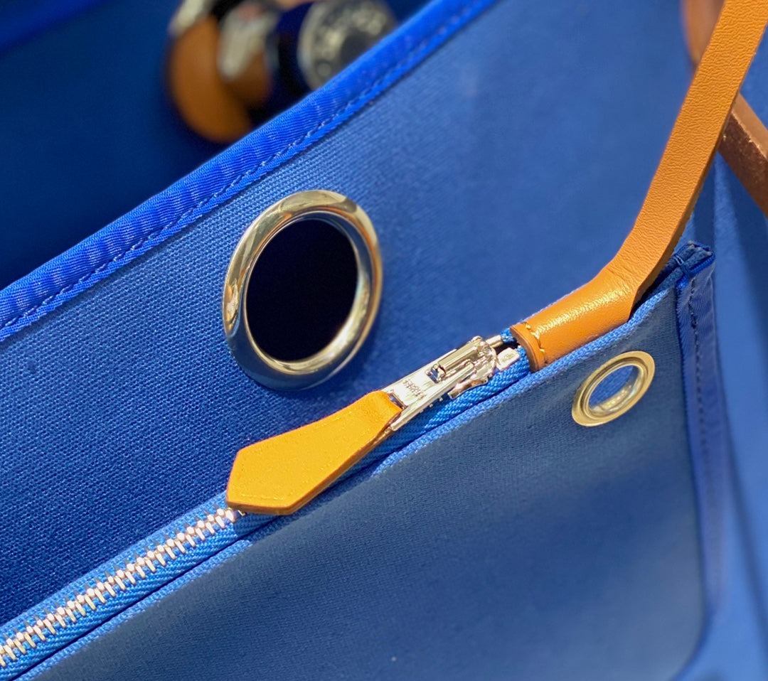 HERBAG 31 TOILE BLUE CANVAS GOLD COWHIDE LEATHER