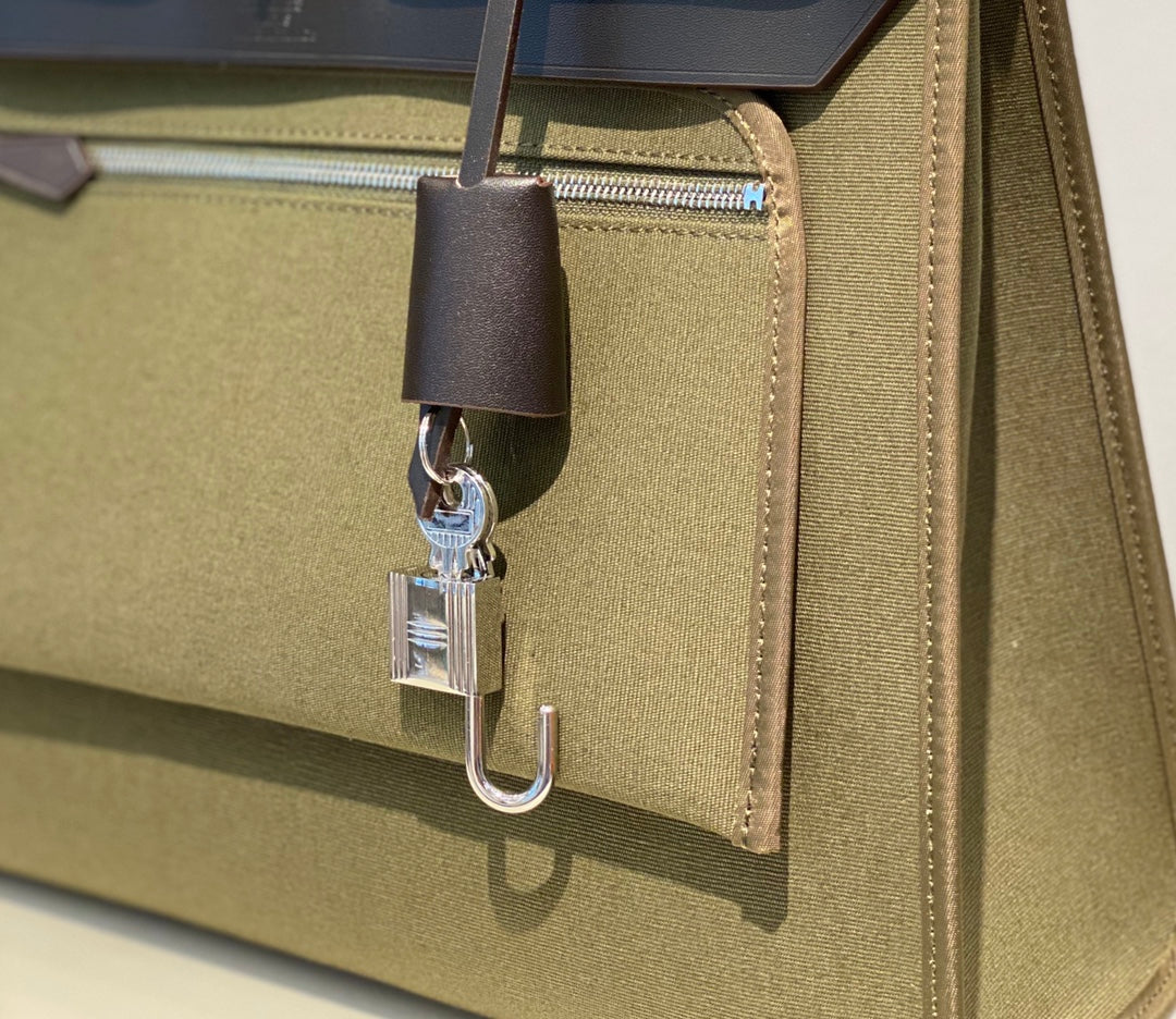 HERBAG 31 TOILE OLIVE CANVAS BLACK COWHIDE LEATHER