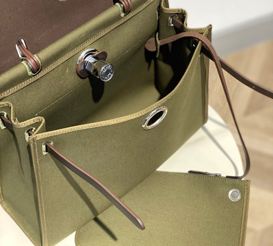 HERBAG 31 TOILE OLIVE CANVAS BLACK COWHIDE LEATHER