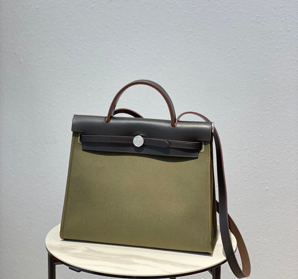 HERBAG 31 TOILE OLIVE CANVAS BLACK COWHIDE LEATHER