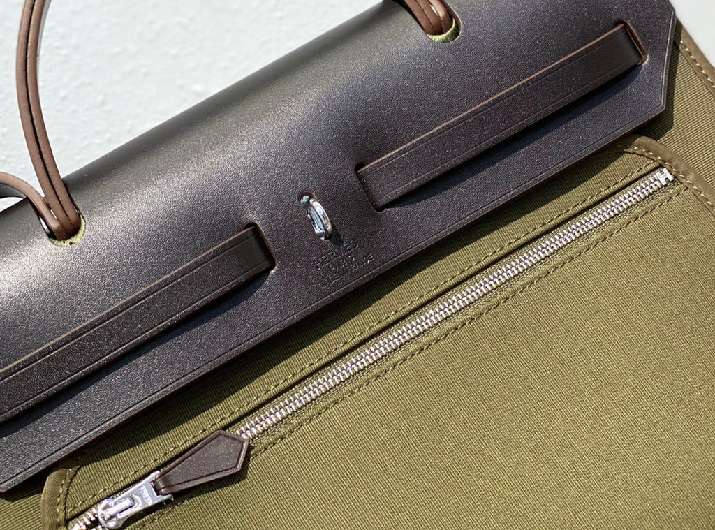 HERBAG 31 TOILE OLIVE CANVAS BLACK COWHIDE LEATHER