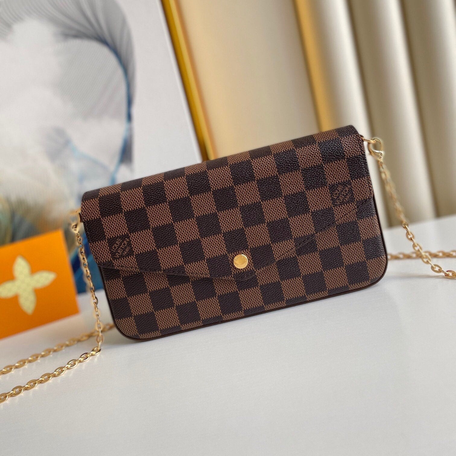 FÉLICIE POCHETTE 21 EN TOILE ENDUIT DAMIER EBENE MARRON QUINCAILLERIE OR