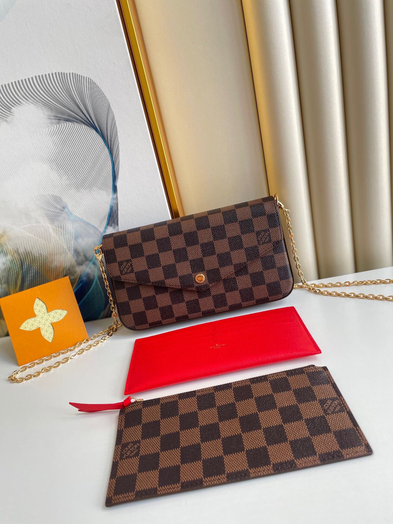 FÉLICIE POCHETTE 21 EN TOILE ENDUIT DAMIER EBENE MARRON QUINCAILLERIE OR