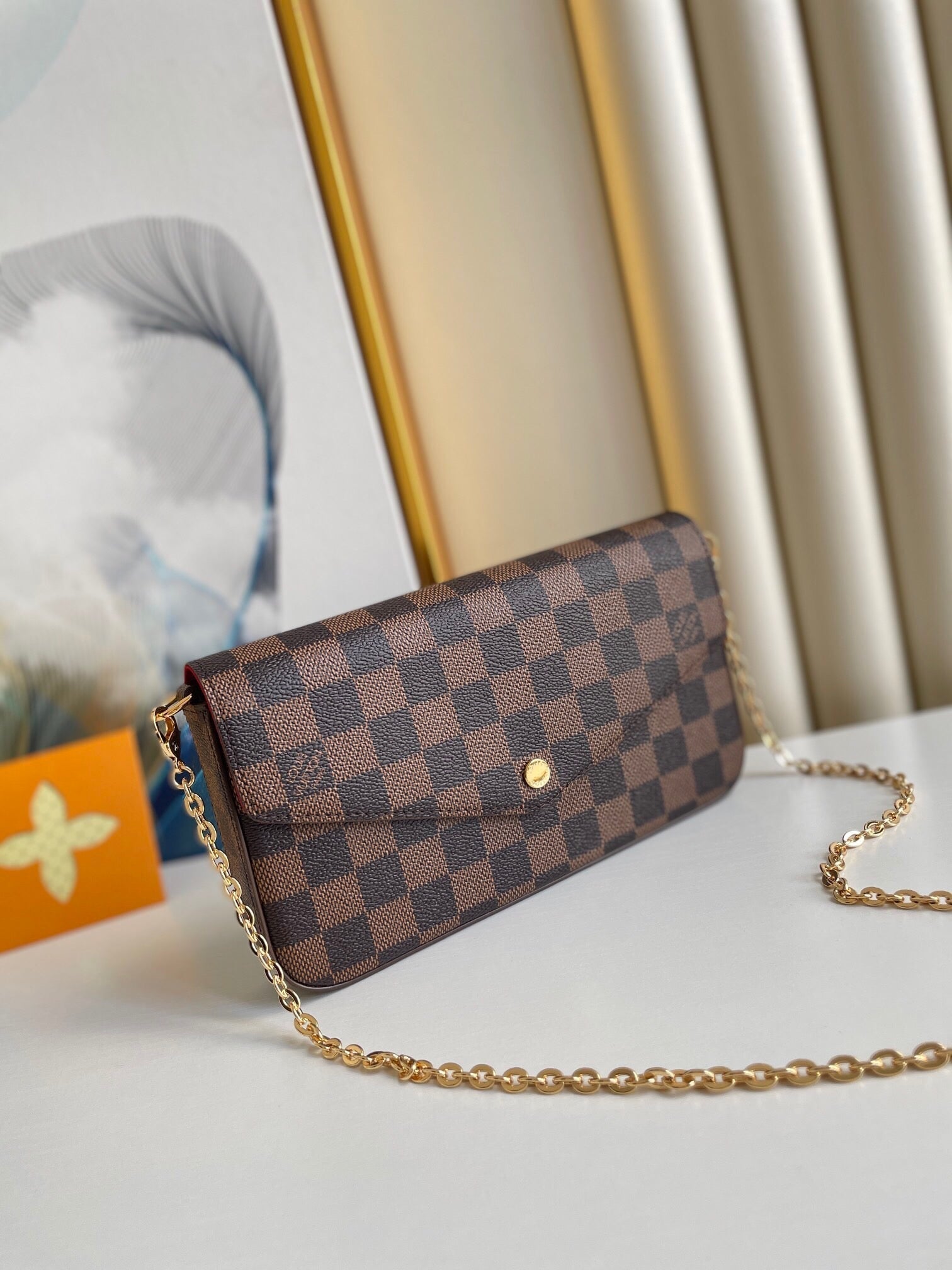 FÉLICIE POCHETTE 21 EN TOILE ENDUIT DAMIER EBENE MARRON QUINCAILLERIE OR