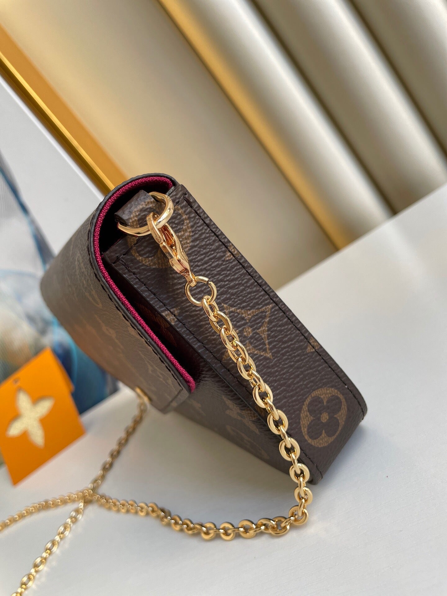 POCHETTE FÉLICIE 21 EN TOILE MONOGRAMME MARRON QUINCAILLERIE DORÉ