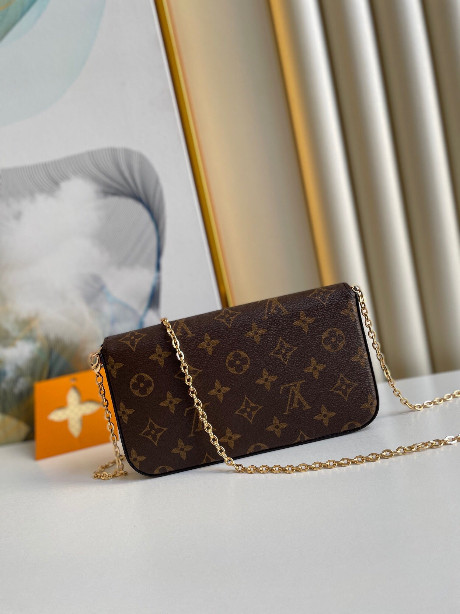 POCHETTE FÉLICIE 21 EN TOILE MONOGRAMME MARRON QUINCAILLERIE DORÉ