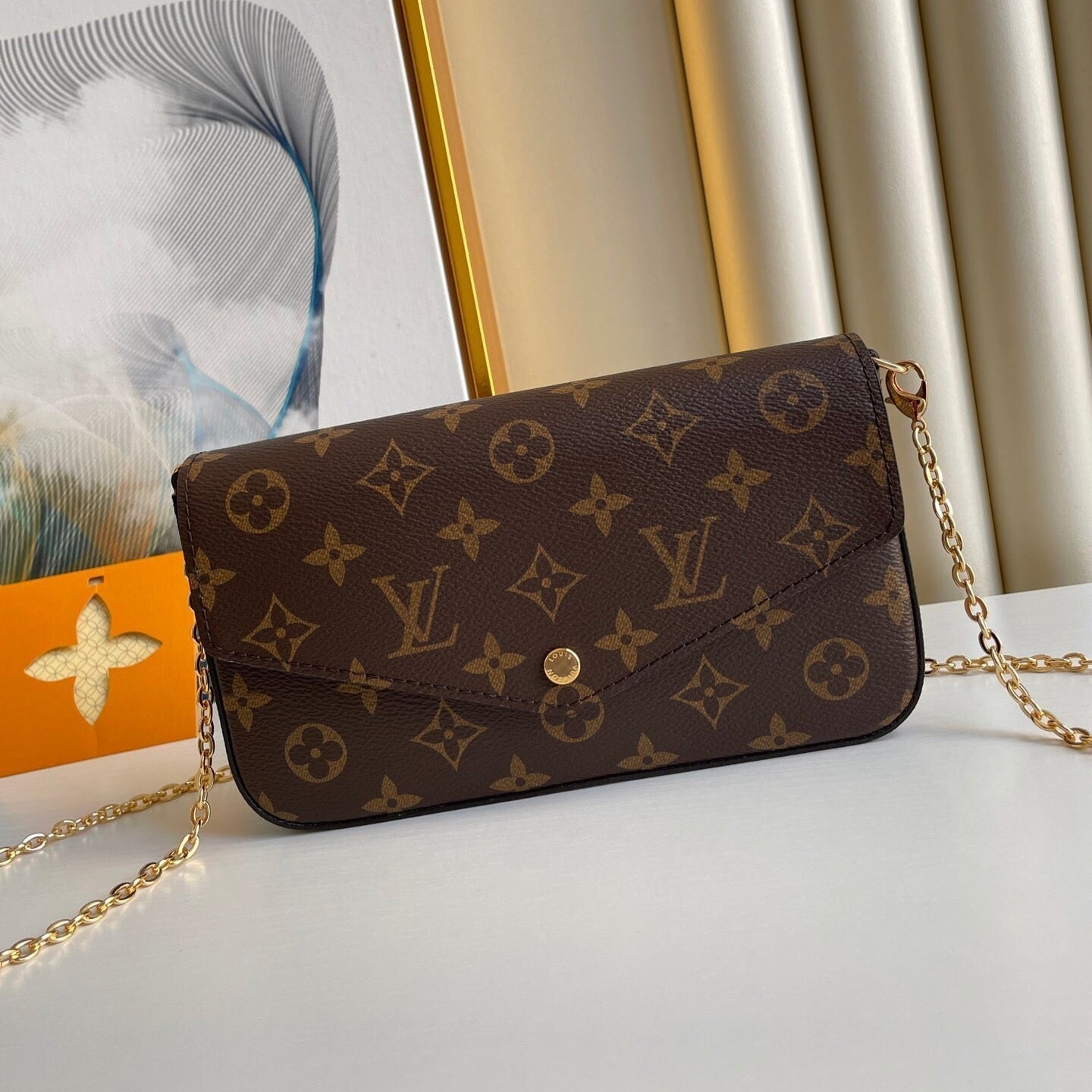 POCHETTE FÉLICIE 21 EN TOILE MONOGRAMME MARRON QUINCAILLERIE DORÉ