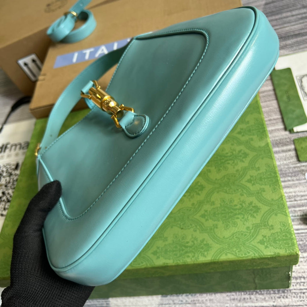 SAC À BANDOULIÈRE GG JACKIE SMALL 28 EN CUIR DE VEAU BLEU PASTEL