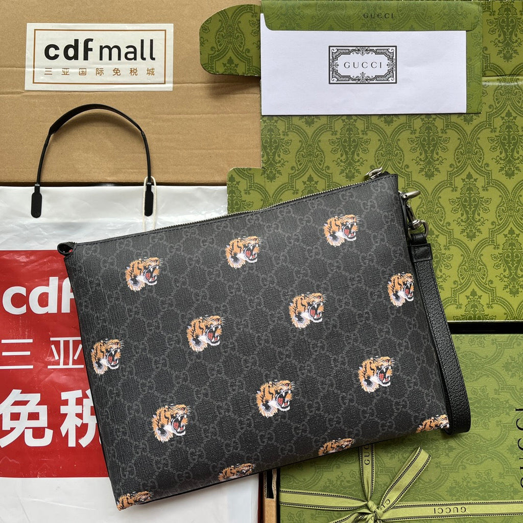Pochette à imprimé tigre 30 en toile monogrammée noire