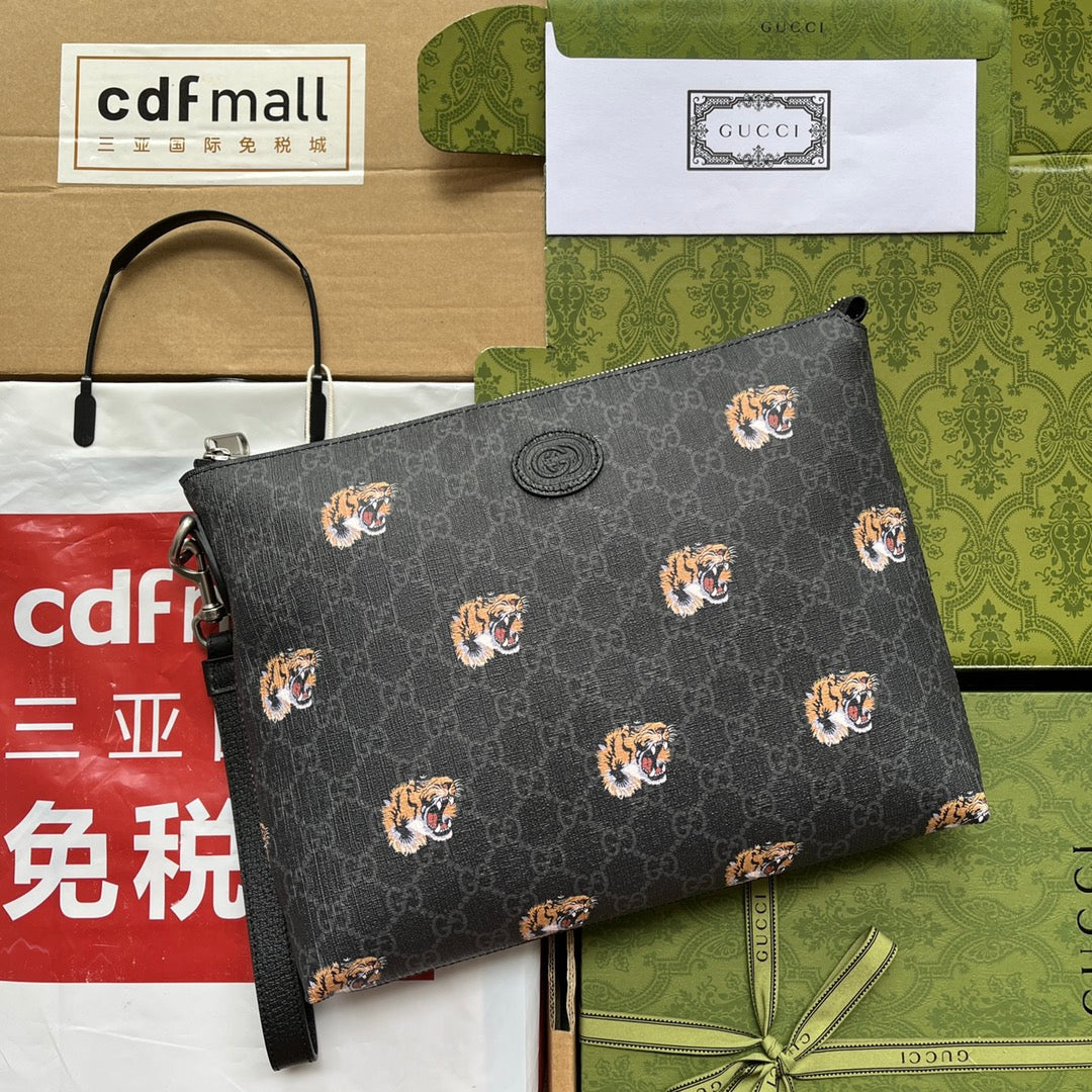 Pochette à imprimé tigre 30 en toile monogrammée noire