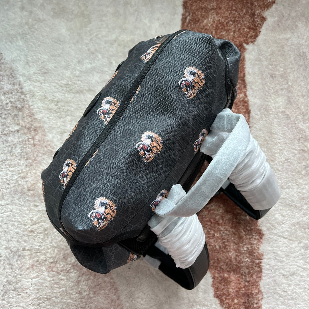 SAC À DOS MOYEN IMPRIMÉ TIGRE 43 EN TOILE NOIRE ET BORDURE EN CUIR
