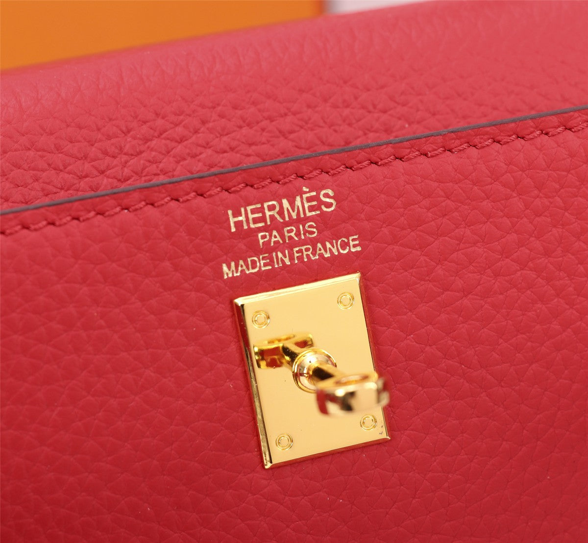 SAC HM KELLY 25 ROUGE TOGO QUINCAILLERIE OR
