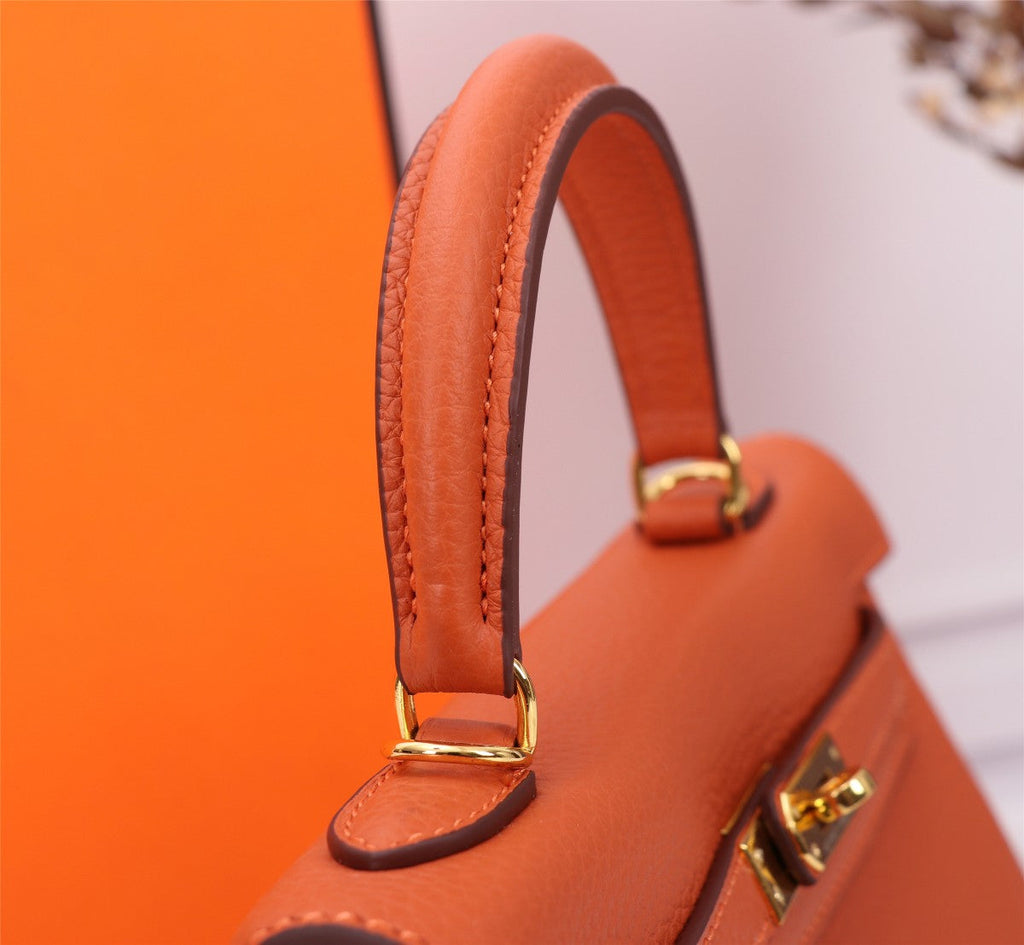 SAC HM KELLY 25 ORANGE TOGO QUINCAILLERIE OR