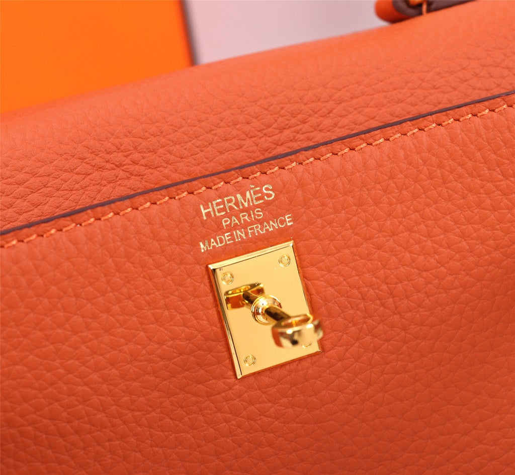 SAC HM KELLY 28 ORANGE TOGO QUINCAILLERIE OR
