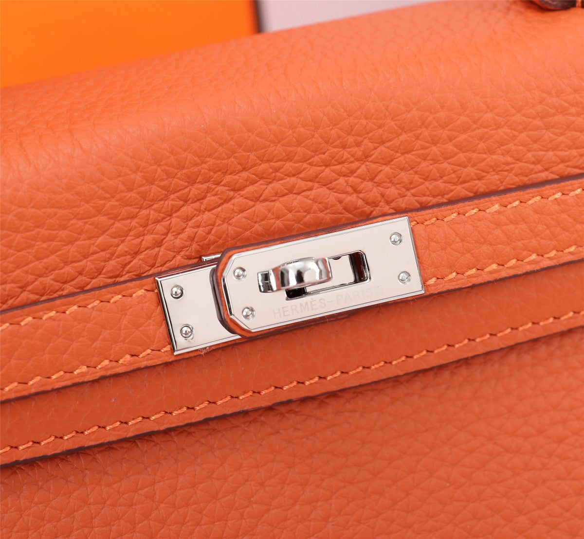SAC HM KELLY 25 ORANGE TOGO QUINCAILLERIE ARGENTÉE