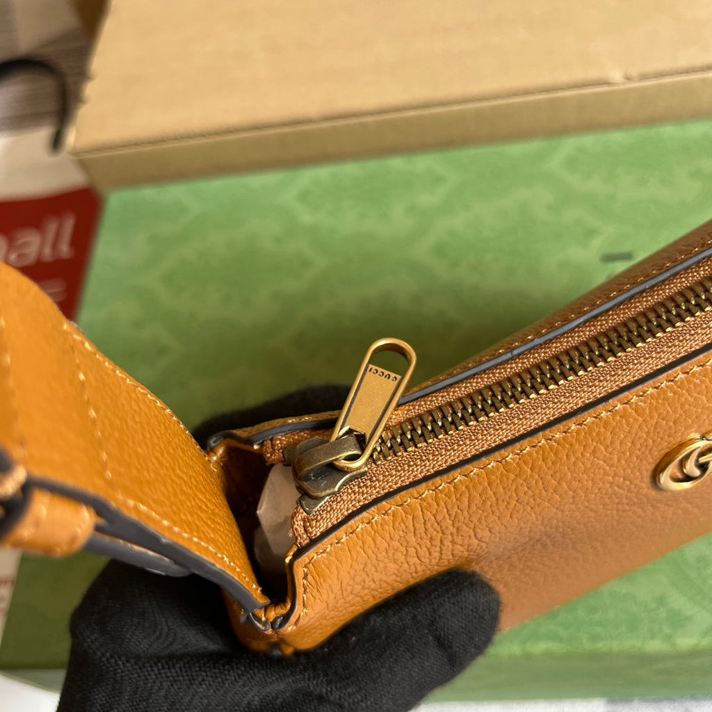SAC À BANDOULIÈRE APHRODITE MINI 21 EN CUIR DE VEAU MARRON CARAMEL
