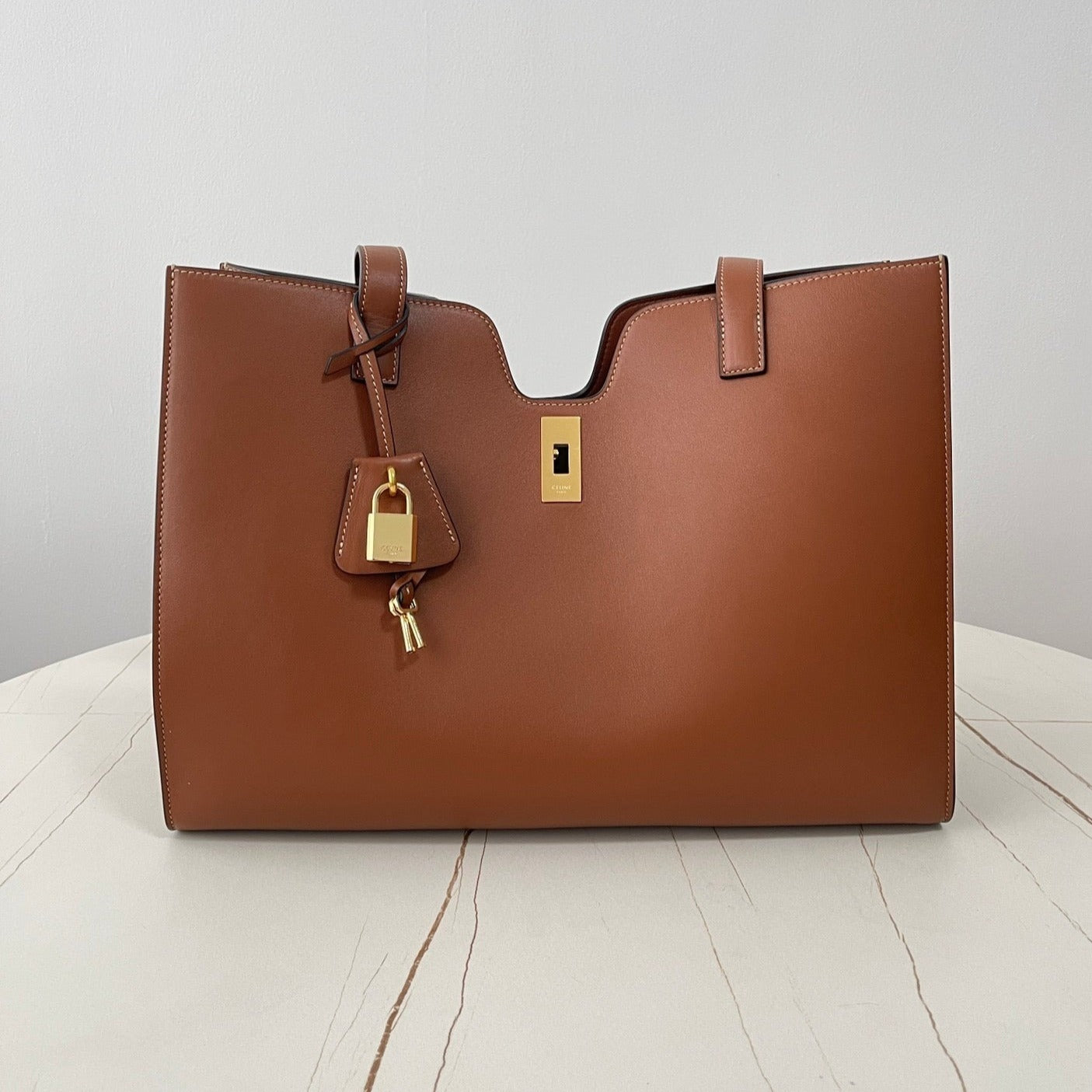 CABAS TRIOMPHE 37 MARRON CANNELLE EN CUIR DE VEAU LISSE