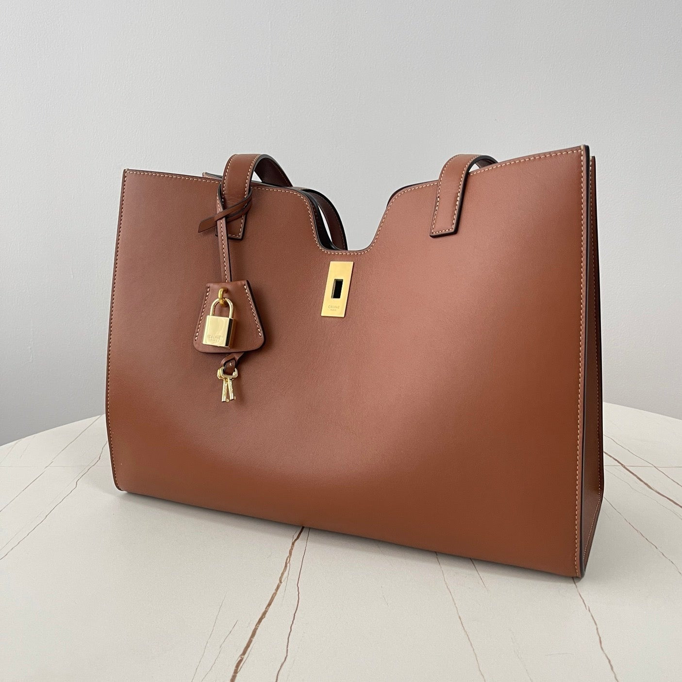 CABAS TRIOMPHE 37 MARRON CANNELLE EN CUIR DE VEAU LISSE