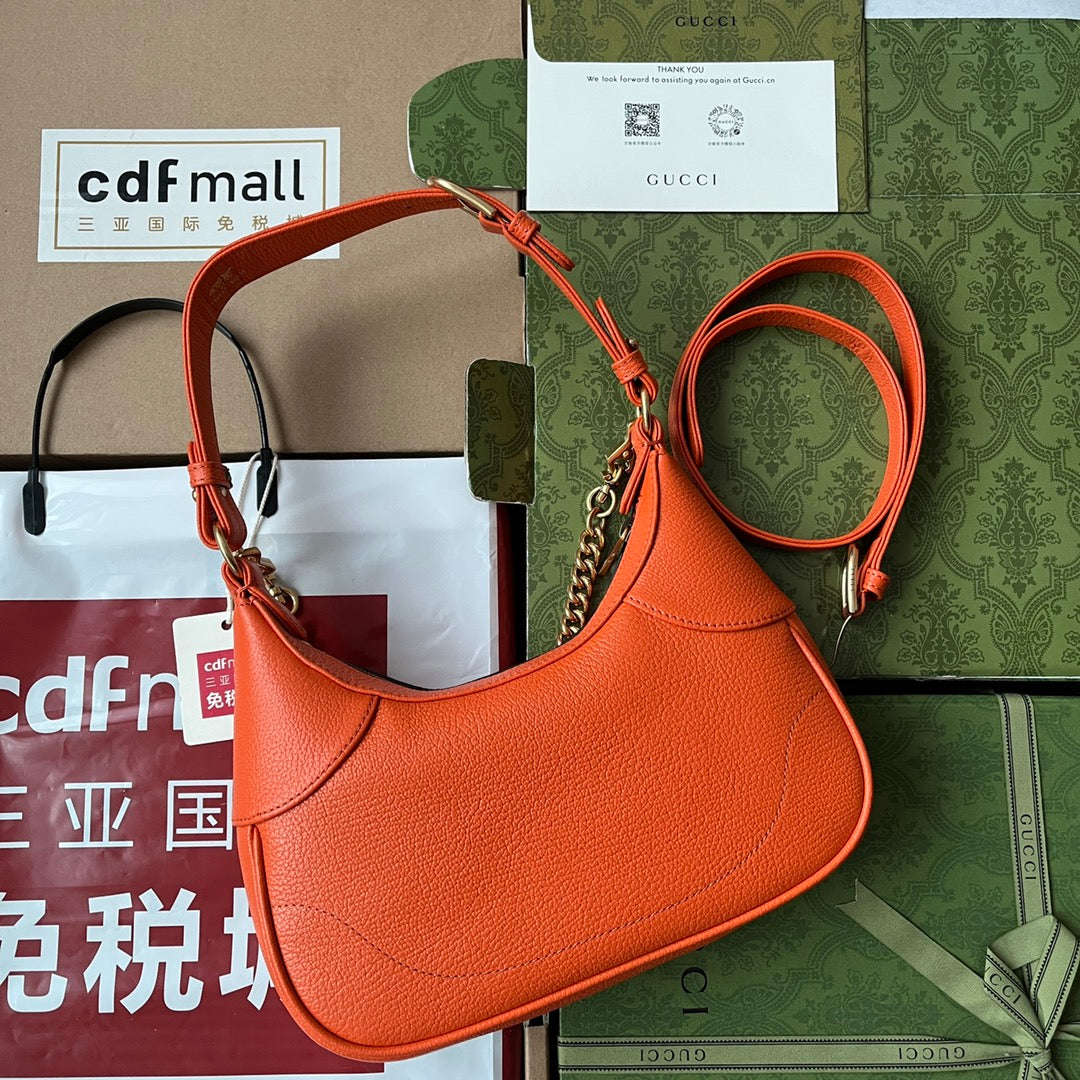 SAC À BANDOULIÈRE 25 EN CUIR DE VEAU ORANGE QUINCAILLERIE DORÉ