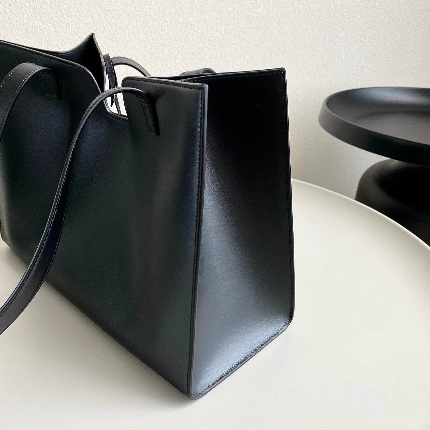 CABAS TRIOMPHE 37 NOIR EN CUIR DE VEAU LISSE