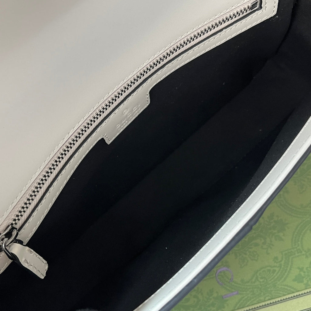 PETIT SAC À BANDOULIÈRE 27 EN CUIR DE VEAU NOIR ET BLANC