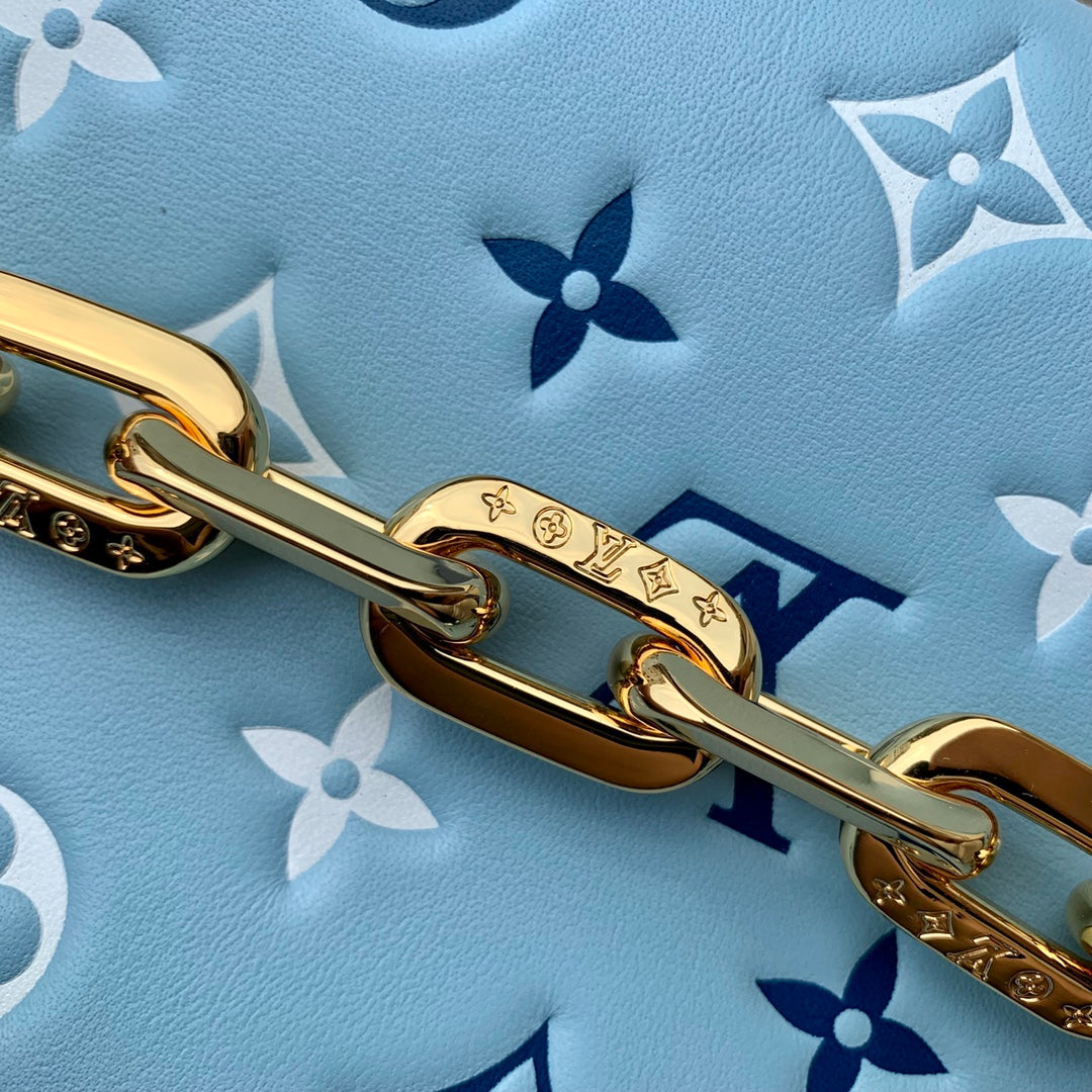 COUSSIN PM 26CM CLOUD BLUE WHITE MONOGRAM EMPREINTE CALFSKIN