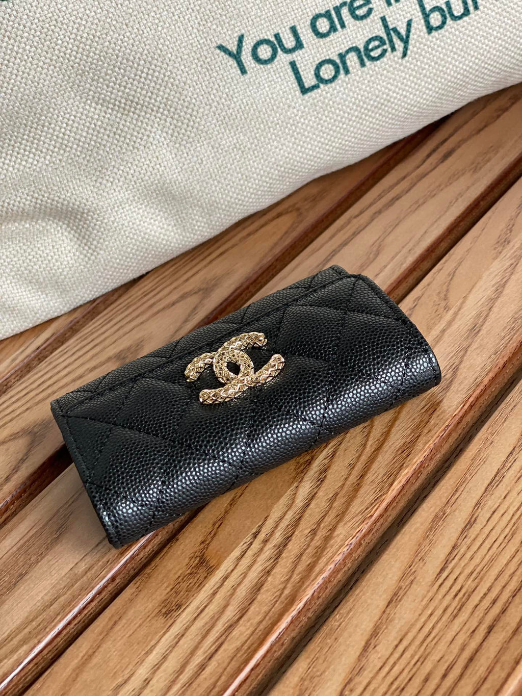Petit portefeuille CC 11 cm, noir caviar, matériel doré clair