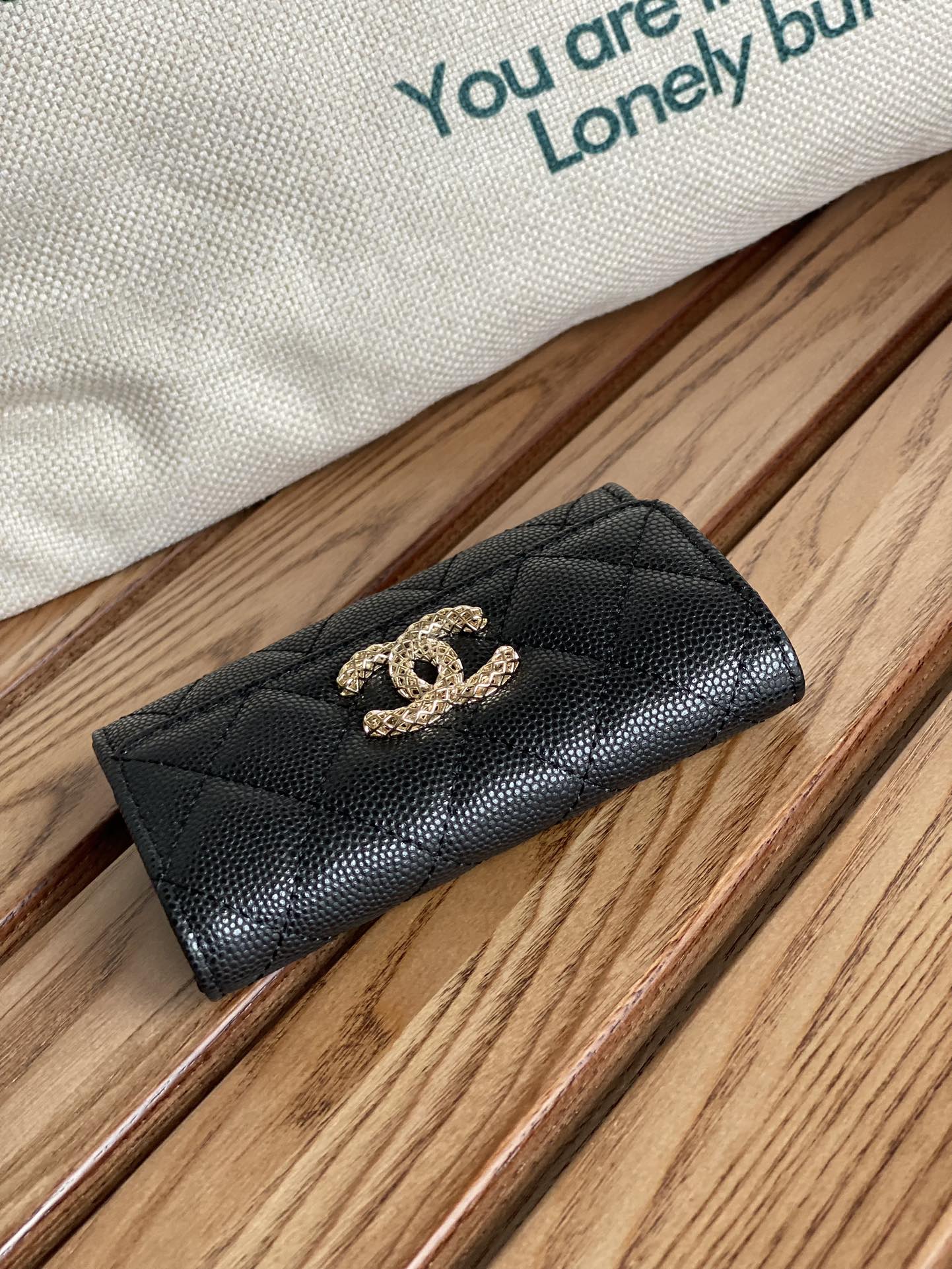 Petit portefeuille CC 11 cm, noir caviar, matériel doré clair