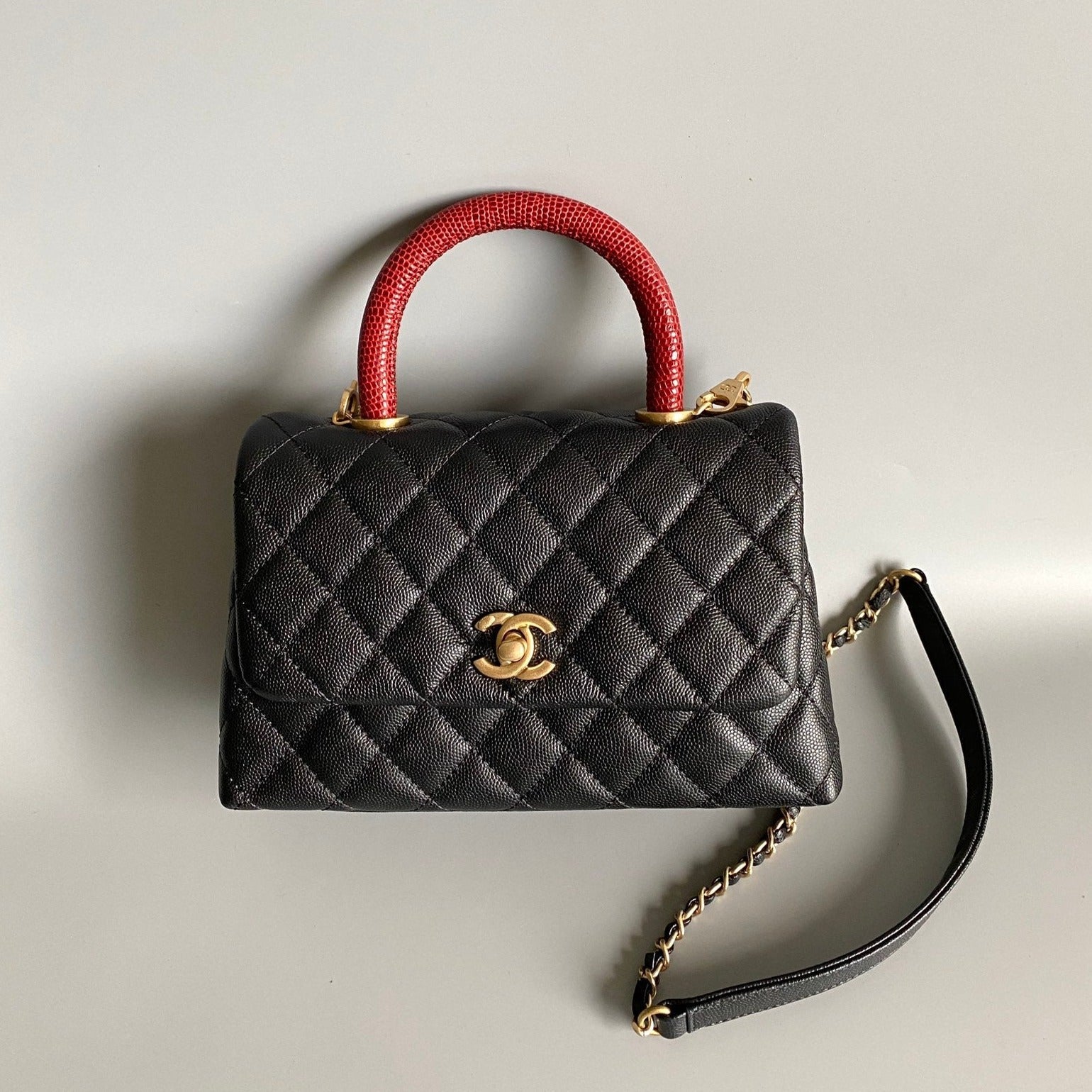 COCO HANDLE FLAP BAG 23CM BLACK QUILTED CAVIAR WITH RED TOP HANDLE