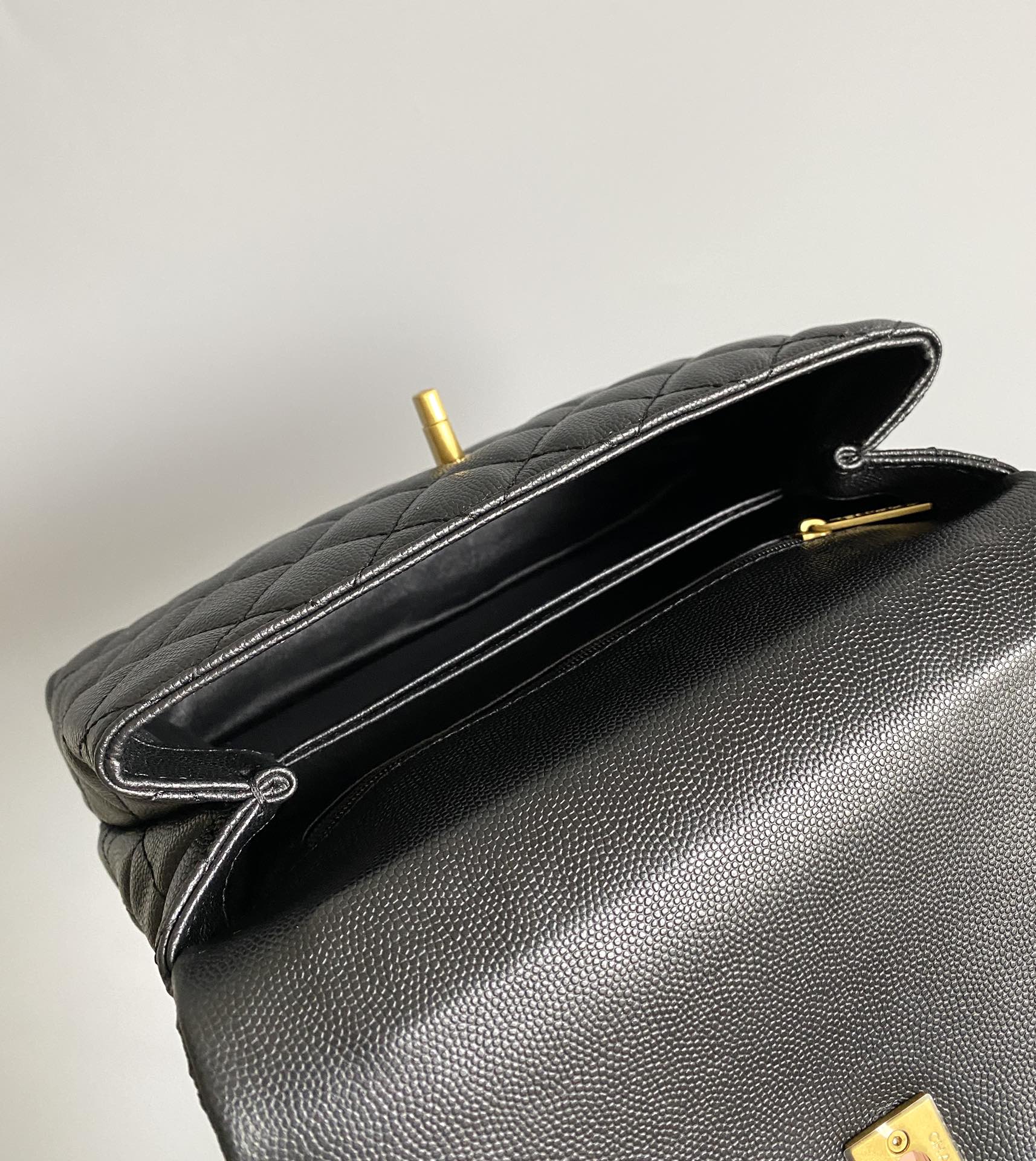 COCO HANDLE FLAP BAG 23CM BLACK QUILTED CAVIAR GOLD HARDWARE