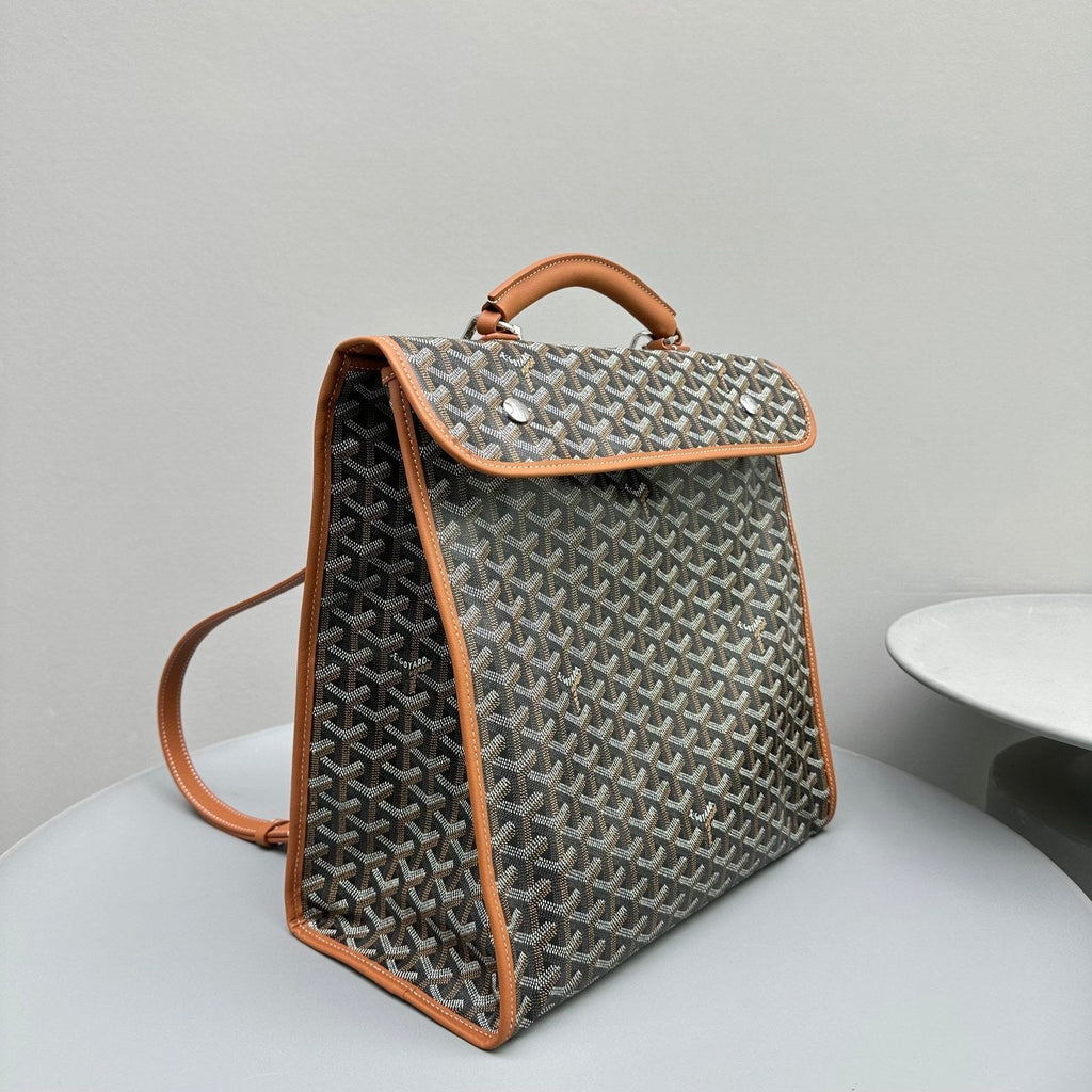 SAC À DOS LEGER 37 EN TOILE GOYARDINE NOIRE AVEC BORDURE EN CUIR DE VEAU BRUN