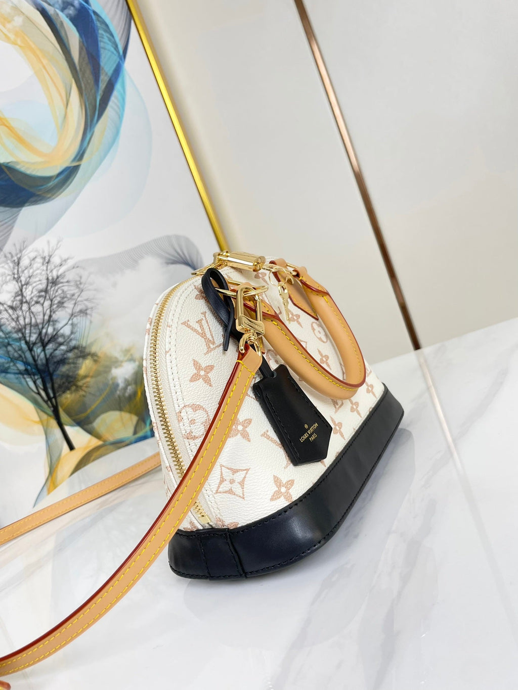 ALMA BB 25 EN TOILE DUNE MONOGRAMME BLANC QUINCAILLERIE DORÉ